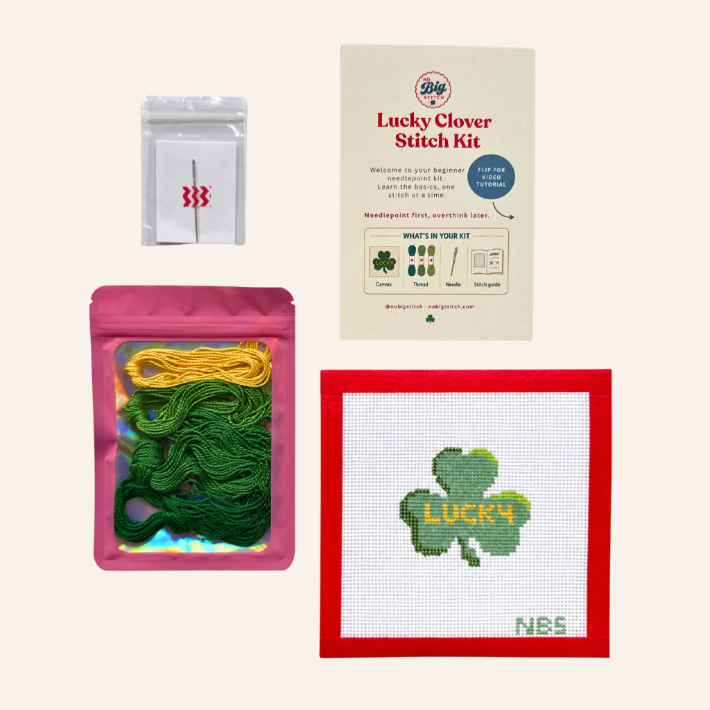 lucky clover needlepoint kit with items, needle, thread, stitch card and canvas
