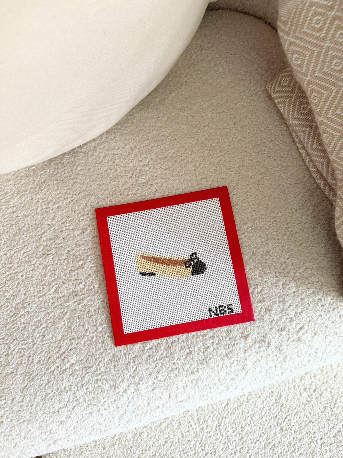 Close-up of the navy and colourful ballet flat design on 13 mesh canvas