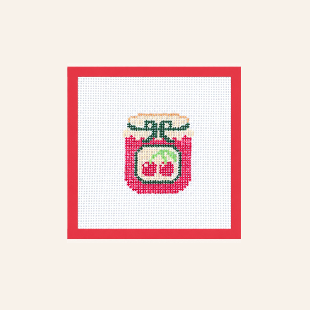 Hand-painted Cherry Jam needlepoint canvas on 13-mesh canvas with a red taped border.
