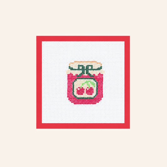 Hand-painted Cherry Jam needlepoint canvas on 13-mesh canvas with a red taped border.